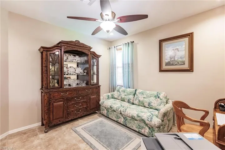 Tiled living room with ceiling fan
