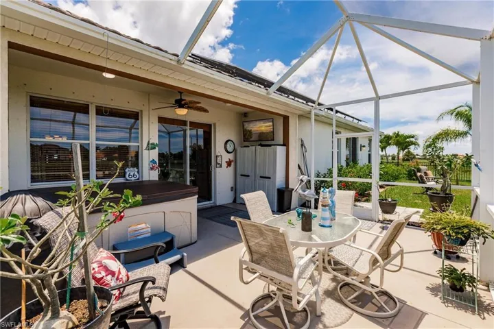 Sunroom featuring ceiling fan