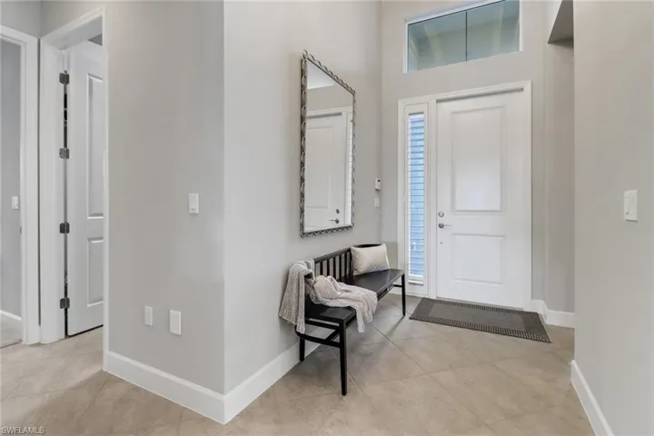 Tiled entryway with plenty of natural light