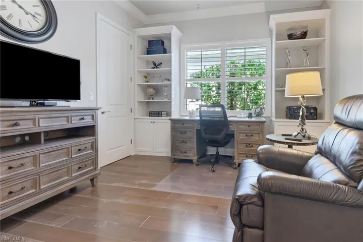 Office featuring ornamental molding and hardwood / wood-style floors