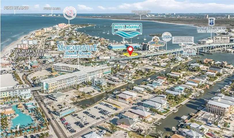 Aerial view of property's location with a large body of water and nearby urban area