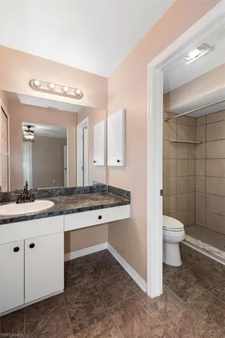 Full bathroom featuring a stall shower and vanity