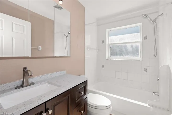 Full bath featuring bathtub / shower combination and vanity