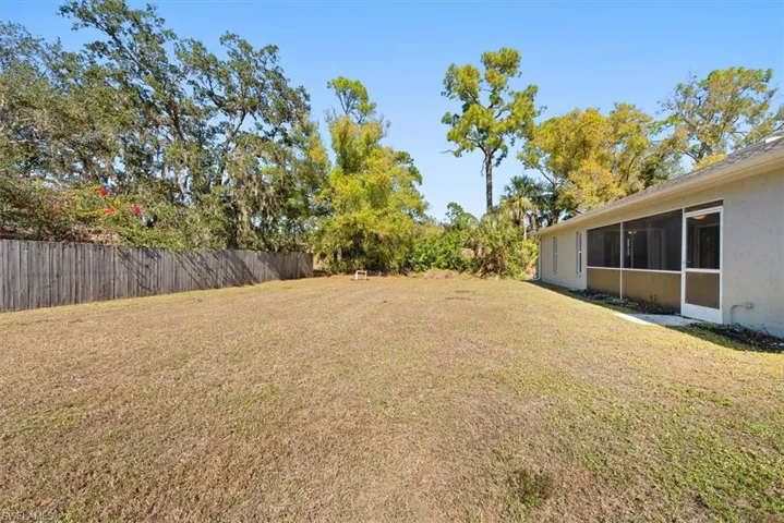 View of yard featuring a sunroom
