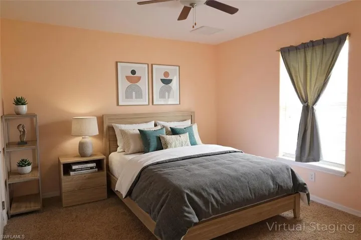 Bedroom with carpet flooring and ceiling fan