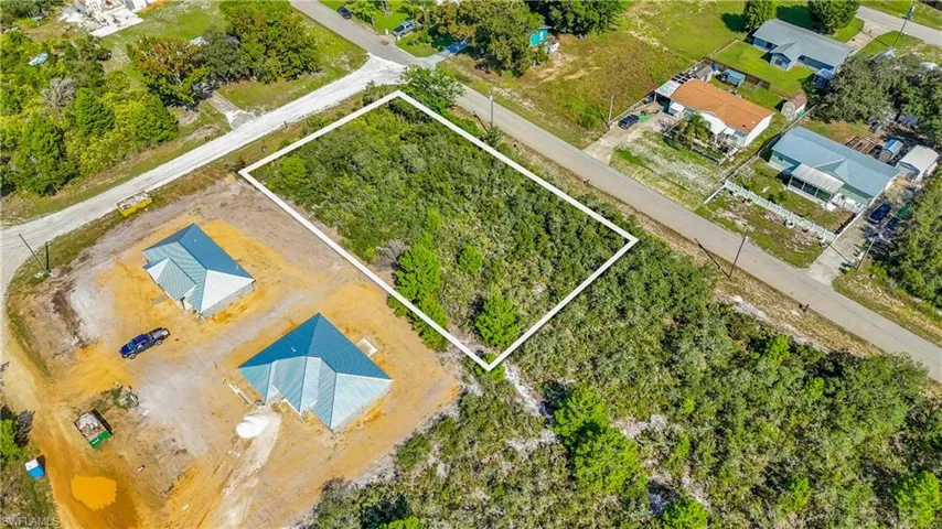 Cleared building sites, paved road access, and perimeter power lines