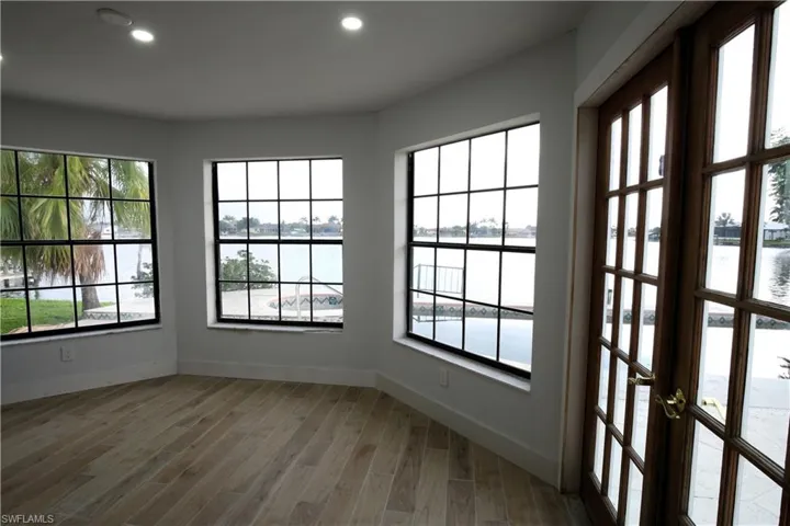 living room with recessed lighting, and high vaulted ceiling