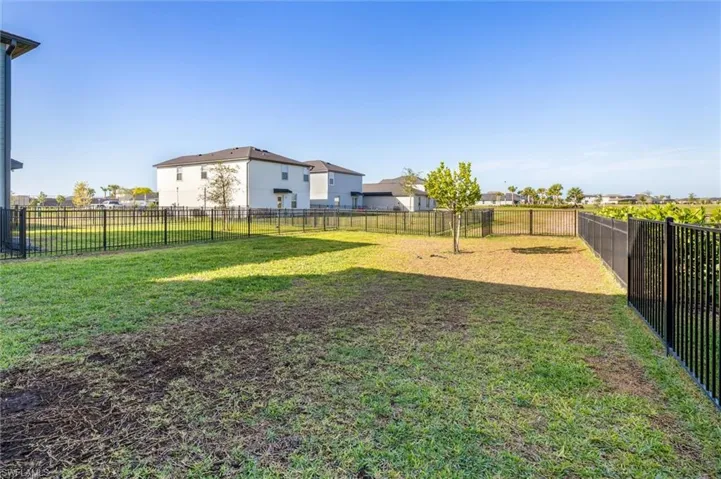 View of fenced backyard