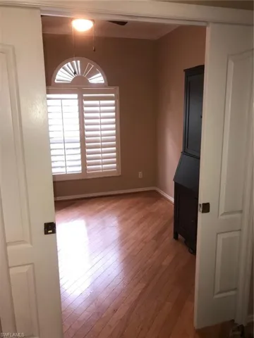 Den with pocket doors & hardwood floors