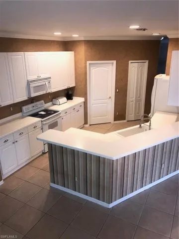 Kitchen with white cabinetry