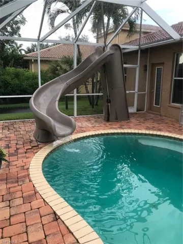 View of pool featuring a water slide