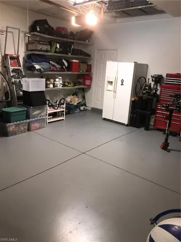 Garage with refrigerator