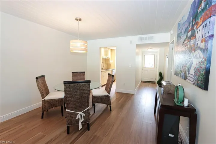 Dining room with sink and hardwood / wood-style flooring