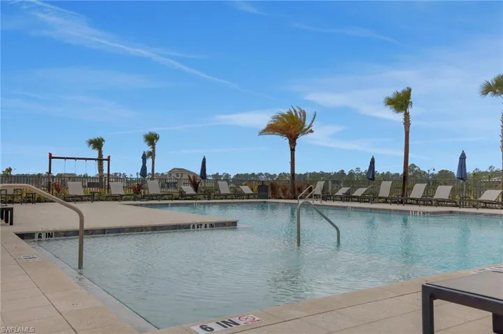 Community pool featuring a patio area