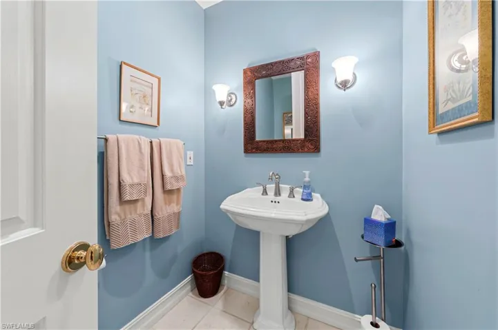 Bathroom featuring tile patterned floors and baseboards