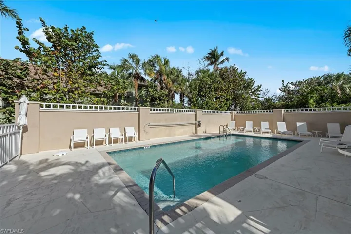 Community pool featuring a patio area