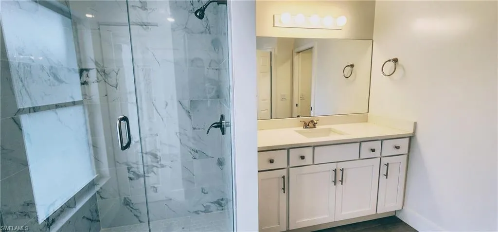 Bathroom featuring vanity and walk in shower