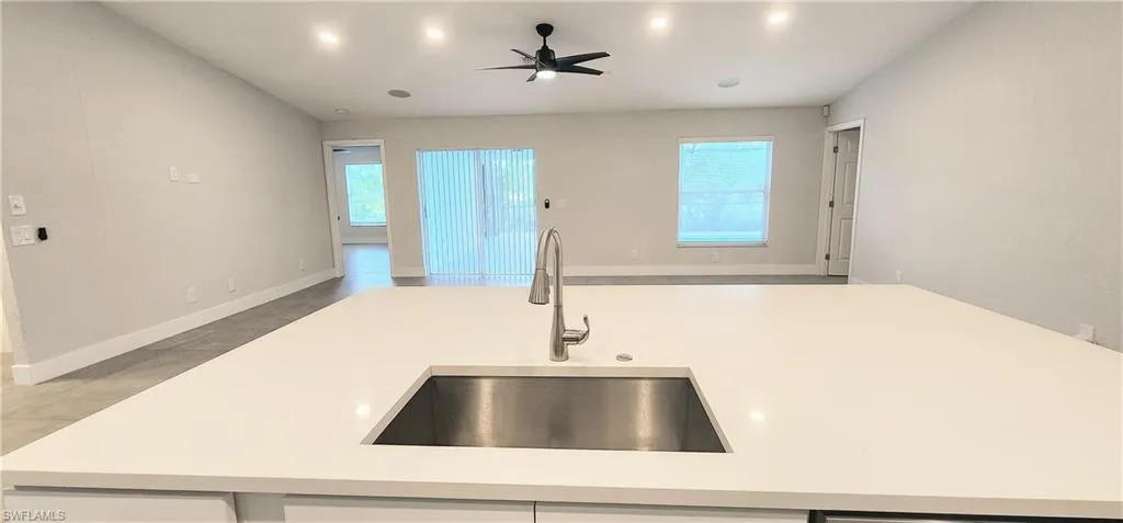 Kitchen featuring sink, a healthy amount of sunlight, and ceiling fan