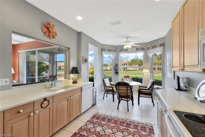 Spacious kitchen with plenty of room for meal preparation. Notice the golf course view.