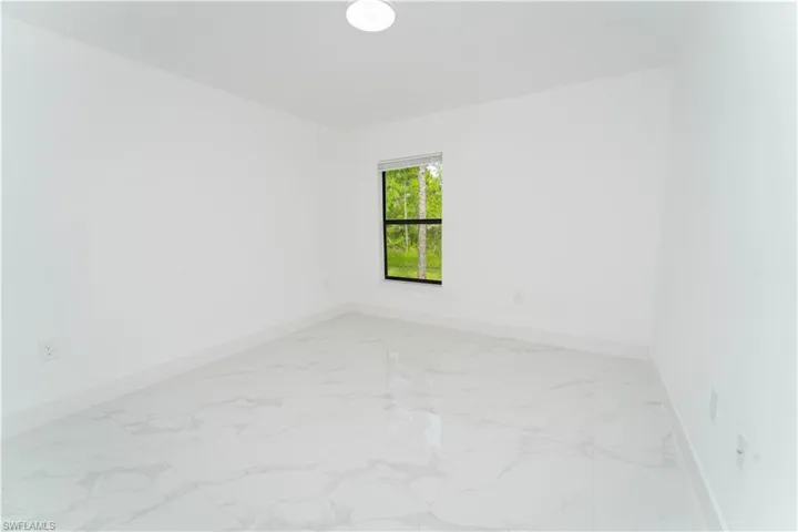 Empty room with light marble finish floors