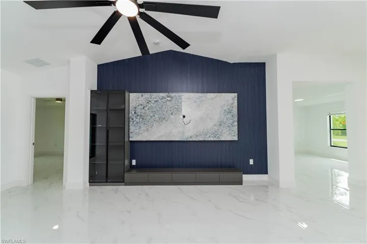 Detailed view of an accent wall and a ceiling fan