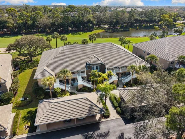 Drone / aerial view of a large body of water and a local golf course