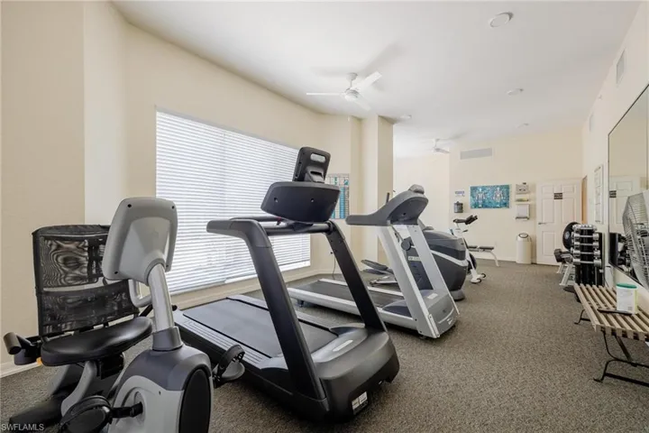 Exercise room with plenty of natural light and ceiling fan
