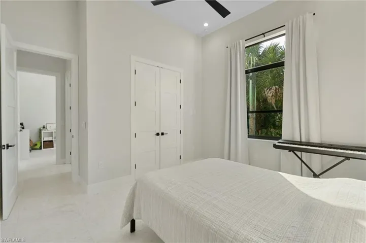 Bedroom featuring a closet and ceiling fan