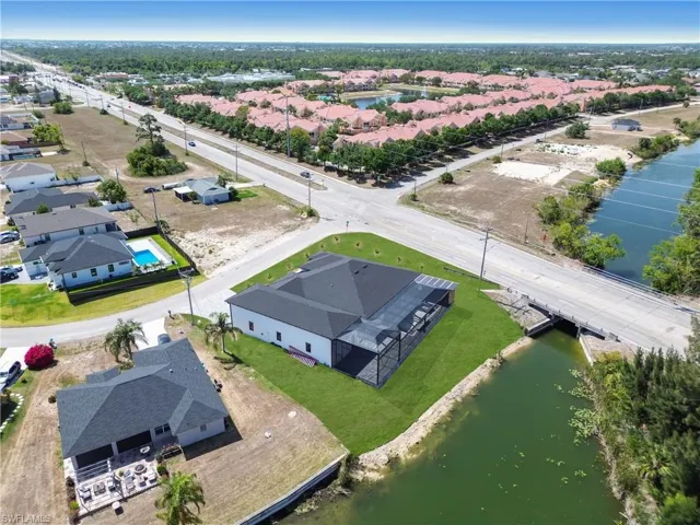 Aerial view featuring a residential view and a water view
