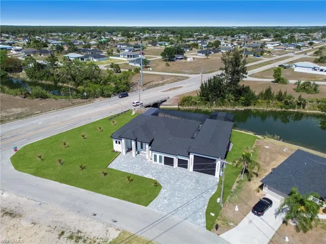 Drone / aerial view featuring a residential view and a water view