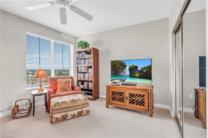 Sitting room with carpet and ceiling fan