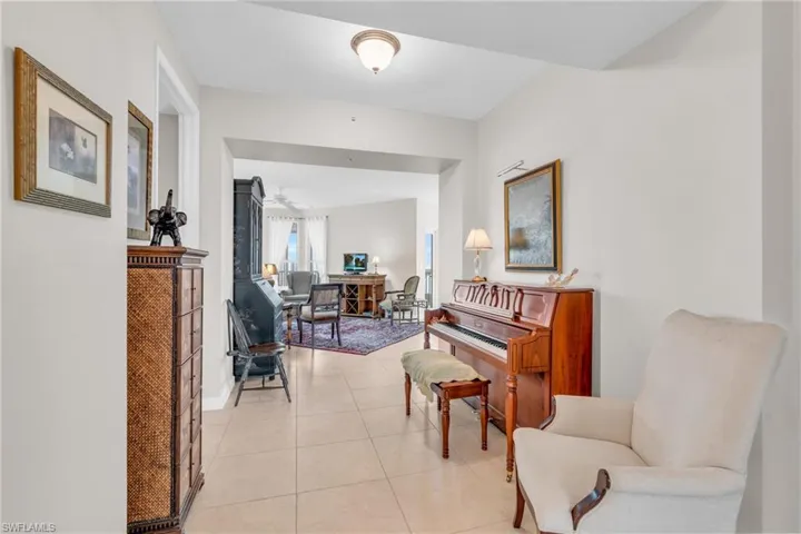 Hallway featuring light tile patterned floors
