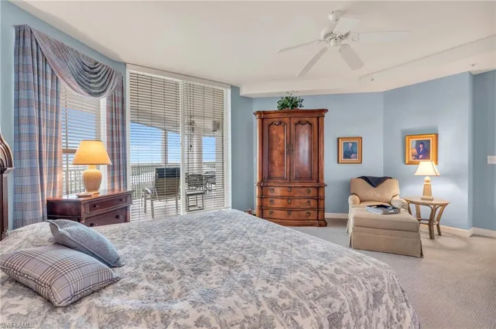Bedroom featuring ceiling fan and light colored carpet