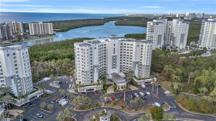 Birds eye view of property featuring a water view