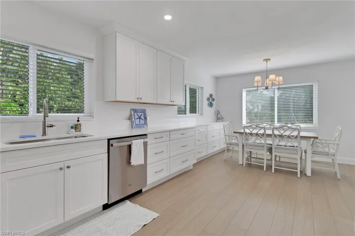 Kitchen with white cabinetry, healthy amount of natural light, dishwasher, and recessed lighting