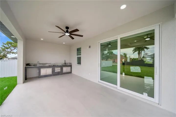 View of patio with ceiling fan