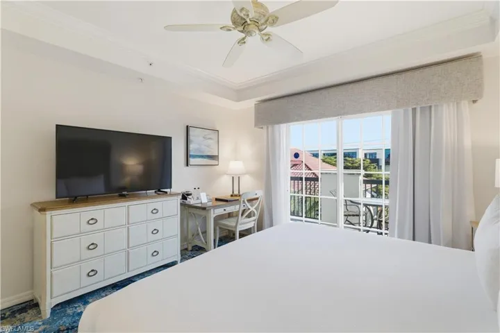 Bedroom featuring ornamental molding and a ceiling fan