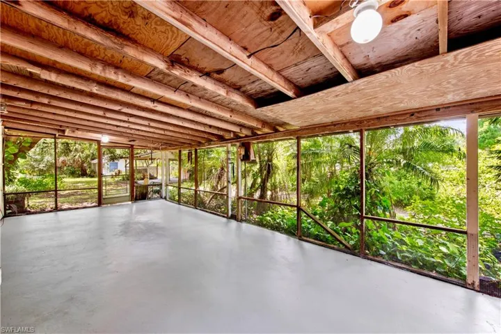 Unfurnished sunroom with healthy amount of natural light