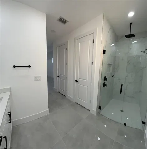 Bathroom with vanity and walk in shower