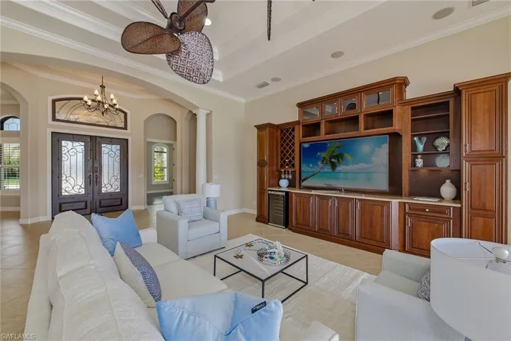 Great room with built-in custom cabinetry and wine cooler