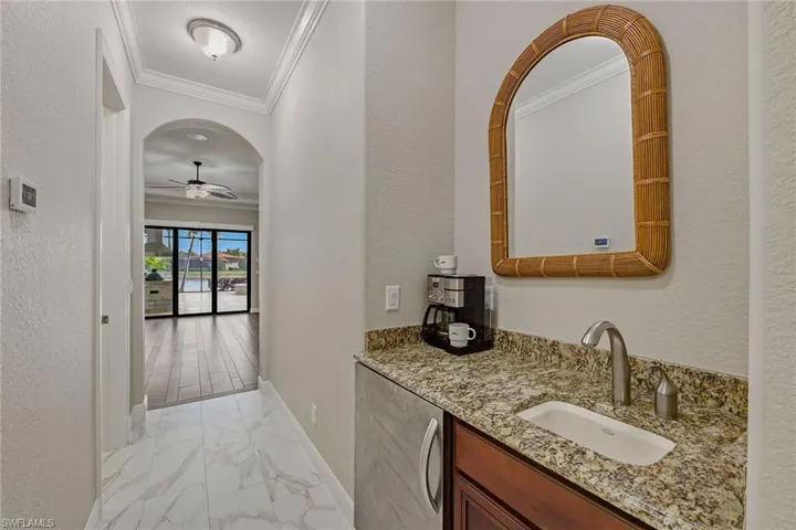 Coffee bar, sink and refrigerator for morning convenience