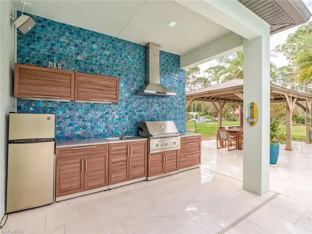 View of patio / terrace featuring area for grilling and a sink