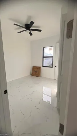 Spare room featuring ceiling fan