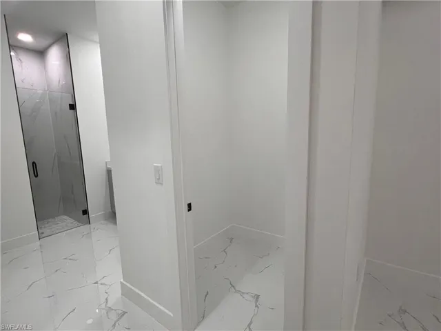 Bathroom with a shower with door