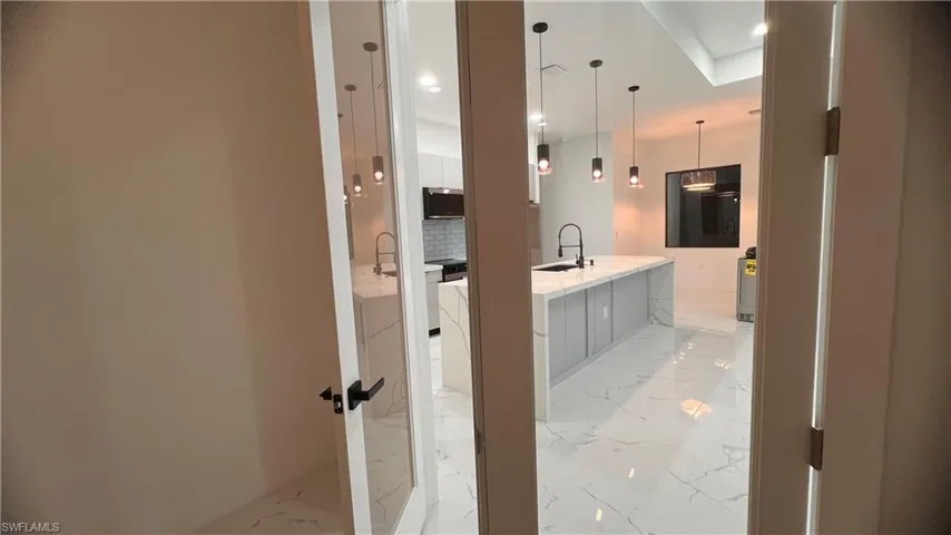 Bathroom featuring backsplash and sink