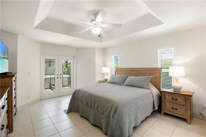 French doors open to hot tub area on lanai