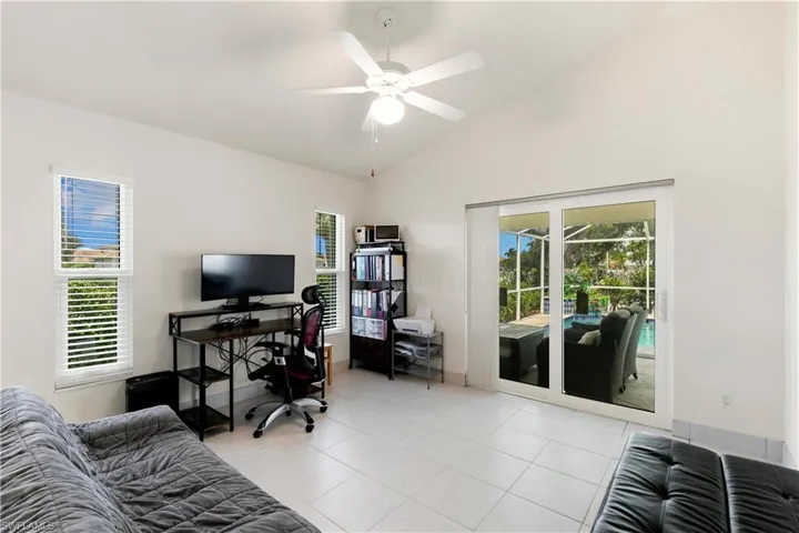 This space opens to the  lanai, could be used for home office, art/yoga/workout studio, guest space