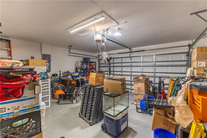 Garage featuring a garage door opener