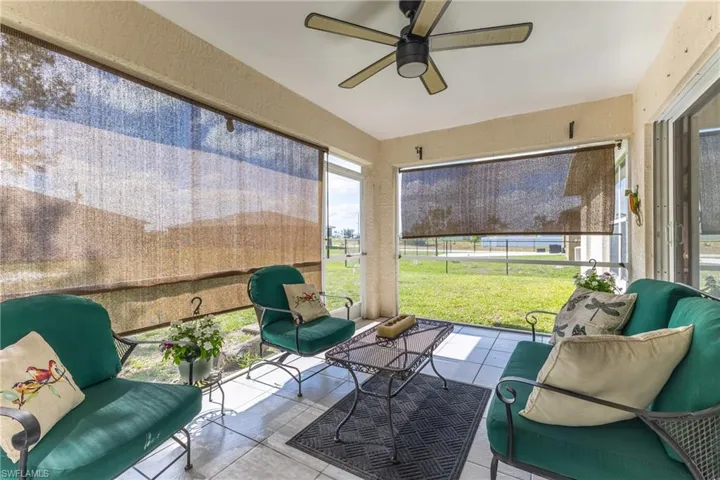 Sunroom featuring ceiling fan