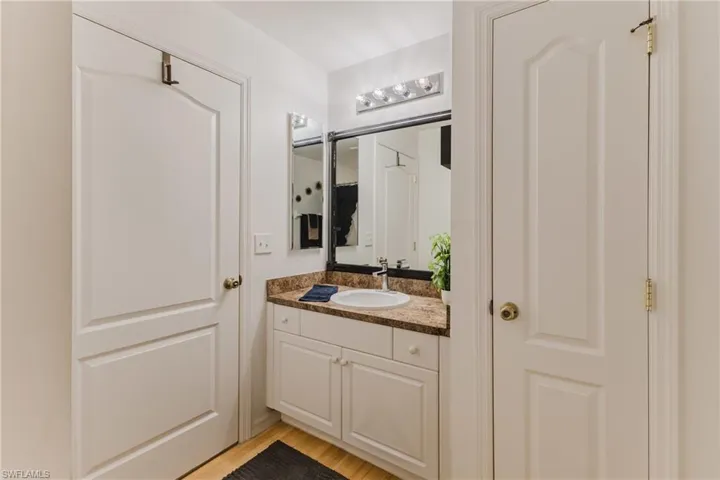 Bathroom with vanity and wood finished floors